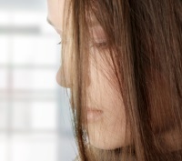 Depressed woman looking down