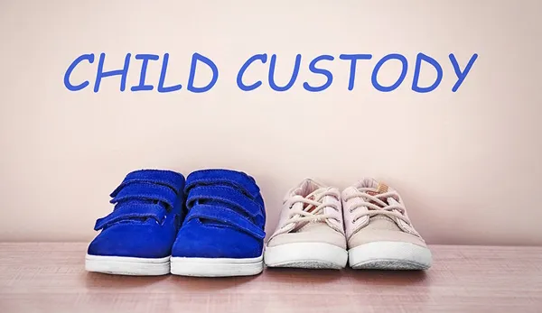 Child custody concept depicted by children's shoes child custody concept