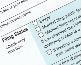Close-up of 1040 tax form showing filing status options tax form showing filing status options