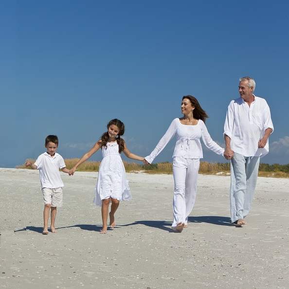 Grandparents enjoying visitation time with grandchildren on the beach Grandparents enjoying visitation time with grandchildren on the beach