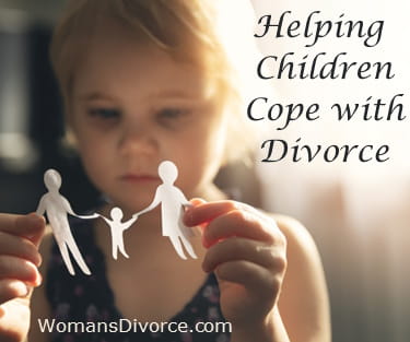 Little girl with paper cut-out of family trying to cope with divorce Little girl looking at paper cut-out of family