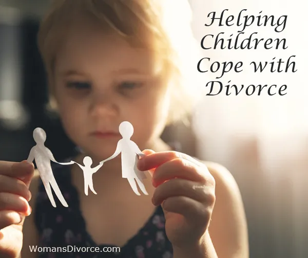 Little girl with paper cut-out of family trying to cope with divorce. Little girl looking at paper cut-out of family