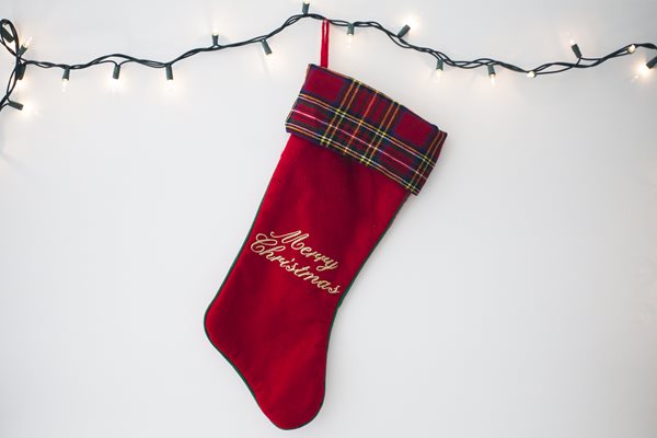 Lone red Christmas stocking signifying the first Christmas after divorce. Lone red Christmas stocking signifying the first Christmas after divorce.