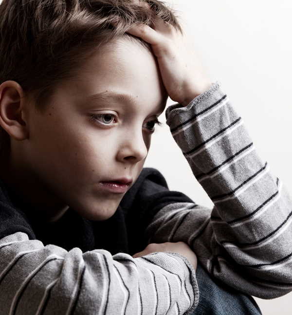 Young boy depressed because of family problems at home. Young boy depressed because of family problems at home.