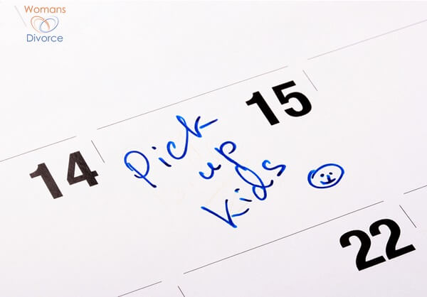 Calendar showing a note to pick up kids on a certain day Calendar showing a note to pick up kids on a certain day