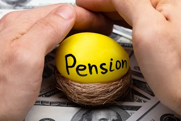 hands protecting a nest egg from pension division in divorce pension division in divorce