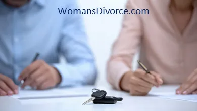 Couple signing a divorce settlement agreement dividing their debts and assets Couple signing settlement agreement and dividing debt in divorce