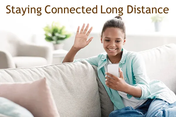 Teenage girl video chatting with parent to keep in touch after divorce Teenage girl video chatting to stay connected with parent